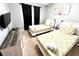 Bedroom with twin-size beds, dresser, and wall-mounted TV at 2556 Bear Creek Ct, Kissimmee, FL 34747