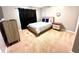 Cozy bedroom with a queen-size bed and modern nightstand at 2556 Bear Creek Ct, Kissimmee, FL 34747