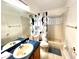 Bathroom with tub and Mickey Mouse shower curtain at 2556 Bear Creek Ct, Kissimmee, FL 34747