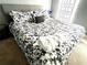 Spacious main bedroom with a king-size bed and floral bedding at 2556 Bear Creek Ct, Kissimmee, FL 34747