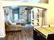 Open living room showcasing a large sectional sofa and high ceilings at 2556 Bear Creek Ct, Kissimmee, FL 34747