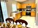 Kitchen with stainless steel appliances and view of dining area at 2556 Bear Creek Ct, Kissimmee, FL 34747