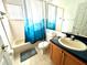 Clean bathroom with shower/tub combo and updated vanity at 2556 Bear Creek Ct, Kissimmee, FL 34747