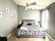 Spacious bedroom with a king-size bed and decorative wall art at 2556 Bear Creek Ct, Kissimmee, FL 34747