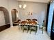 Casual dining area with six chairs and wood table at 2556 Bear Creek Ct, Kissimmee, FL 34747