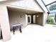 Outdoor patio with grilling station and access to the house at 2556 Bear Creek Ct, Kissimmee, FL 34747