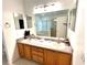 Double vanity bathroom with a large mirror and plenty of cabinet space at 2556 Bear Creek Ct, Kissimmee, FL 34747