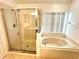 Bathroom with shower and garden tub at 2556 Bear Creek Ct, Kissimmee, FL 34747