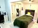 Bright bedroom with a double bed and mirrored closet at 457 Prestwick Pl # 457, Kissimmee, FL 34759
