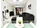 Living room with gray sectional sofa, glass top coffee table, and fireplace at 457 Prestwick Pl # 457, Kissimmee, FL 34759