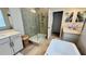 Spacious bathroom with a large walk-in shower and a soaking tub at 13706 Werrington Dr, Winter Garden, FL 34787