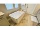 Clean bathroom with a modern soaking tub, perfect for relaxation at 13706 Werrington Dr, Winter Garden, FL 34787