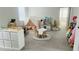 Bright playroom featuring a teepee, toy kitchen, and ample storage at 13706 Werrington Dr, Winter Garden, FL 34787