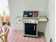 Three-burner Weber Spirit gas grill on a brick patio at 13706 Werrington Dr, Winter Garden, FL 34787