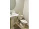 Clean powder room with white pedestal sink and toilet at 13706 Werrington Dr, Winter Garden, FL 34787