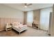 Charming bedroom with a full bed, neutral decor, and a built in bookcase at 13706 Werrington Dr, Winter Garden, FL 34787