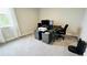Home office with large desk, two monitors and ample storage at 13706 Werrington Dr, Winter Garden, FL 34787