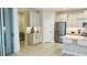Modern kitchen with stainless steel appliances and light cabinets at 13706 Werrington Dr, Winter Garden, FL 34787