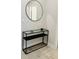 Entryway with a stylish console table and round mirror at 13706 Werrington Dr, Winter Garden, FL 34787
