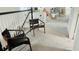 Bright landing area with two mid-century modern chairs and view of staircase at 13706 Werrington Dr, Winter Garden, FL 34787