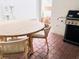 Outdoor patio with a round table, chairs, and a gas grill at 13706 Werrington Dr, Winter Garden, FL 34787