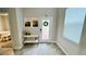 Light and airy entryway with console table, artwork, and view to bedroom at 13706 Werrington Dr, Winter Garden, FL 34787