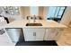 Kitchen island with sink, dishwasher, and ample storage at 13706 Werrington Dr, Winter Garden, FL 34787