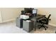 Modern home office featuring a large desk, two monitors, and mobile filing cabinets at 13706 Werrington Dr, Winter Garden, FL 34787