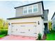 Two-story home with attached garage and landscaped yard at 13706 Werrington Dr, Winter Garden, FL 34787
