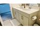 Elegant bathroom with double vanity, neutral tones and a view to a hallway at 13706 Werrington Dr, Winter Garden, FL 34787
