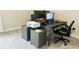 Spacious home office with large desk, two monitors, and mobile file cabinets at 13706 Werrington Dr, Winter Garden, FL 34787