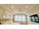 Primary bedroom boasting a king bed, large windows, and a ceiling fan at 13706 Werrington Dr, Winter Garden, FL 34787
