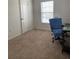 Bright bedroom with carpeted floors and large window at 1523 Wynford Cir, Tavares, FL 32778
