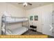 Bedroom with bunk beds and ceiling fan at 443 Corvina Dr, Davenport, FL 33897