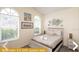 Bedroom with queen bed and neutral decor at 443 Corvina Dr, Davenport, FL 33897
