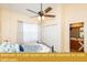 Bedroom with queen bed and attached en-suite bathroom at 443 Corvina Dr, Davenport, FL 33897