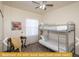 Bedroom with bunk beds and workspace at 443 Corvina Dr, Davenport, FL 33897