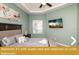 Bedroom with queen bed and attached en-suite bathroom at 443 Corvina Dr, Davenport, FL 33897