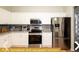 Fully equipped kitchen with stainless steel appliances and granite countertops at 443 Corvina Dr, Davenport, FL 33897