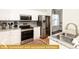 Fully equipped kitchen with stainless steel appliances and granite countertops at 443 Corvina Dr, Davenport, FL 33897