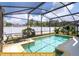 Inviting pool area with screened enclosure and ample seating at 443 Corvina Dr, Davenport, FL 33897