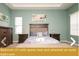 Bedroom with queen bed and attached en-suite bathroom at 443 Corvina Dr, Davenport, FL 33897
