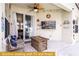 Outdoor patio with seating, firepit, and TV at 443 Corvina Dr, Davenport, FL 33897
