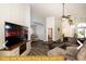 Cozy living area with large TV and comfortable seating at 443 Corvina Dr, Davenport, FL 33897