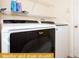 In-unit washer and dryer with shelving at 443 Corvina Dr, Davenport, FL 33897