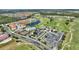 Aerial view of community, including homes, pool, and golf course at 107 Hampton Loop, Davenport, FL 33837