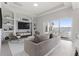 Living area with built-in shelving, sliding doors to patio and pool at 107 Hampton Loop, Davenport, FL 33837