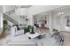 Open concept living room with modern furniture and a view into the kitchen at 107 Hampton Loop, Davenport, FL 33837