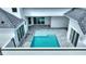 Elevated view of a refreshing pool and patio area, perfect for relaxation at 107 Hampton Loop, Davenport, FL 33837