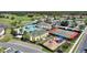 Aerial view of community pool, tennis courts, playground, and clubhouse at 107 Hampton Loop, Davenport, FL 33837